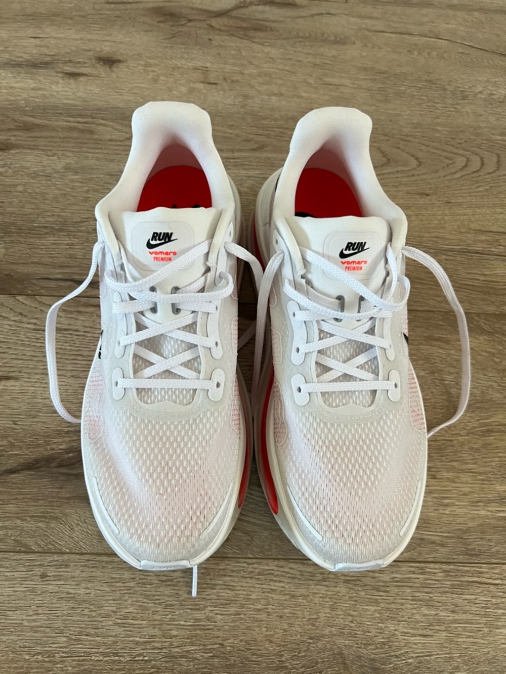 Nike size 9 Vomero Plus White Sneakers with Red Accent